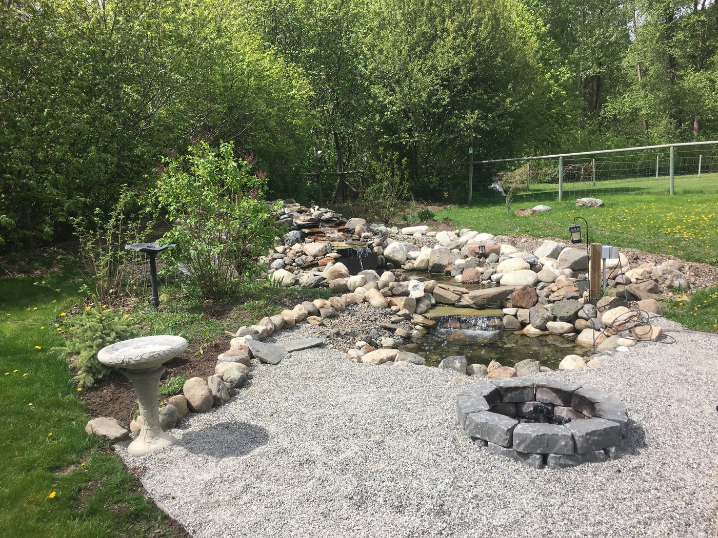 Stone waterfall and pond landscape